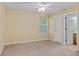 Spacious bedroom with ceiling fan, neutral walls, and ample closet space at 3127 Fields Dr, Lithonia, GA 30038