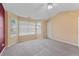Spacious bedroom with vaulted ceiling, neutral carpeting, and large windows at 3127 Fields Dr, Lithonia, GA 30038