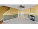 Living room with fireplace, carpet, and ceiling fan at 3127 Fields Dr, Lithonia, GA 30038