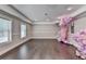 Finished basement offering a large open space with hardwood floors at 1567 Maplecliff Way, Sugar Hill, GA 30518