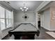 Game room with a pool table and large windows at 1567 Maplecliff Way, Sugar Hill, GA 30518