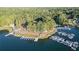 Aerial view of a lakefront community with marina, clubhouse, and lush green landscape at 7149 Burnside Ct, Villa Rica, GA 30180