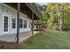 Walkout basement with patio, leading to a grassy yard at 7149 Burnside Ct, Villa Rica, GA 30180