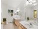 Elegant bathroom with double vanity and stained glass window at 7149 Burnside Ct, Villa Rica, GA 30180