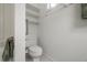 Small bathroom with toilet and shelving at 7149 Burnside Ct, Villa Rica, GA 30180