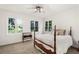 Comfortable bedroom with hardwood floors and lake views at 7149 Burnside Ct, Villa Rica, GA 30180