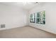 Large bedroom with ample natural light and carpet at 7149 Burnside Ct, Villa Rica, GA 30180