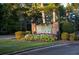 Fairfield Plantation entrance with stone sign and landscaping at 7149 Burnside Ct, Villa Rica, GA 30180