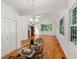 Charming dining area with hardwood floors and glass table at 7149 Burnside Ct, Villa Rica, GA 30180