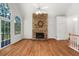 Gathering room with hardwood floors, stone fireplace, and access to deck at 7149 Burnside Ct, Villa Rica, GA 30180