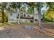 Two-story house with deck, nestled in a wooded area at 7149 Burnside Ct, Villa Rica, GA 30180