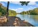 Serene lake view from a wooded lakeside lot at 7149 Burnside Ct, Villa Rica, GA 30180