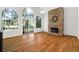 Spacious living room with hardwood floors, stone fireplace and large windows at 7149 Burnside Ct, Villa Rica, GA 30180