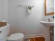 Convenient powder room with pedestal sink and toilet at 7149 Burnside Ct, Villa Rica, GA 30180