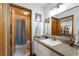 Bathroom with vanity, large mirror, and walk-in closet at 5934 S Deshon Ct, Lithonia, GA 30058