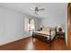 Bright bedroom with hardwood floors and ceiling fan at 5934 S Deshon Ct, Lithonia, GA 30058