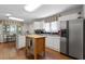 Eat-in kitchen with stainless steel appliances and hardwood floors at 5934 S Deshon Ct, Lithonia, GA 30058