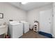 Laundry room with washer, dryer, and utility sink at 5934 S Deshon Ct, Lithonia, GA 30058