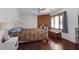 Primary bedroom with hardwood floors and built-in shelving at 5934 S Deshon Ct, Lithonia, GA 30058