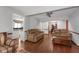 Open concept living room with hardwood floors, and views of kitchen at 5934 S Deshon Ct, Lithonia, GA 30058