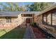 Stone front elevation with a wood door and walkway at 5934 S Deshon Ct, Lithonia, GA 30058