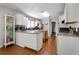 Kitchen with white cabinets, granite countertops, and island at 5934 S Deshon Ct, Lithonia, GA 30058