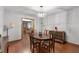 Dining room with hardwood floors and a view into the living room at 5934 S Deshon Ct, Lithonia, GA 30058