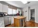 Modern kitchen with granite countertops, stainless steel appliances, and an island at 5934 S Deshon Ct, Lithonia, GA 30058