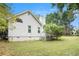 Side view of a charming house with a deck and green lawn at 2797 Club Forest Dr, Conyers, GA 30013