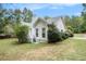 Single story home with white siding, a deck, and mature landscaping at 2797 Club Forest Dr, Conyers, GA 30013
