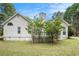 Rear view of house showing deck and landscaping at 2797 Club Forest Dr, Conyers, GA 30013