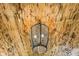 Close-up of a unique ceiling fixture with a metal cage and wood ceiling at 7350 Ono Rd, Palmetto, GA 30268