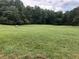 Open field with lush grass and hay bales at 7350 Ono Rd, Palmetto, GA 30268