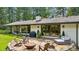 Stone patio with fire pit and seating area, perfect for entertaining at 7350 Ono Rd, Palmetto, GA 30268