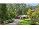 Ranch home exterior, featuring a large garage and expansive yard at 7350 Ono Rd, Palmetto, GA 30268