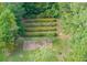 Aerial view showing home nestled in lush trees near a lake at 7350 Ono Rd, Palmetto, GA 30268