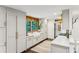 Modern kitchen with white cabinetry, a large farmhouse sink, and a quartz countertop at 7350 Ono Rd, Palmetto, GA 30268