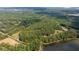 Large lot with lakefront access surrounded by trees at 7350 Ono Rd, Palmetto, GA 30268
