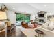 Spacious living room with fireplace, hardwood floors, and large sliding glass doors at 7350 Ono Rd, Palmetto, GA 30268