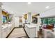 Open concept kitchen with white shaker cabinets, quartz countertops and gold accents at 7350 Ono Rd, Palmetto, GA 30268