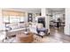 Open living space with sectional sofa, fireplace, and dining area at 7350 Ono Rd, Palmetto, GA 30268