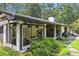 Charming home exterior with a sunroom and landscaped yard at 7350 Ono Rd, Palmetto, GA 30268