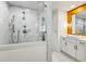Bright bathroom featuring a marble shower, white vanity, and wood accents at 7350 Ono Rd, Palmetto, GA 30268