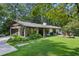 Updated ranch home with a large backyard, detached garage, and lush landscaping at 7350 Ono Rd, Palmetto, GA 30268