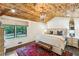Large bedroom with high ceilings, a wood-paneled ceiling, and plush bedding at 7350 Ono Rd, Palmetto, GA 30268