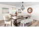 Modern farmhouse dining room with a large table and statement mirror at 7350 Ono Rd, Palmetto, GA 30268