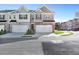 Modern two-story townhome with two-car garage and attractive landscaping at 179 Hampton Cir, Mcdonough, GA 30253