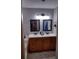 Bathroom with double vanity and updated fixtures at 115 Elberta St, Mcdonough, GA 30253