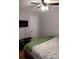 Bedroom with king-size bed, wood-look floors, and ceiling fan at 115 Elberta St, Mcdonough, GA 30253