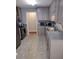 Updated kitchen featuring stainless steel appliances and gray cabinets at 115 Elberta St, Mcdonough, GA 30253